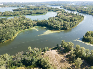 Panoramic view of the Dnieper river in Kiev. Sunny clear day. Aerial drone view.