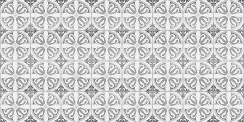 Seamless old gray grey white vintage shabby patchwork mosaic motif tiles stone concrete cement wall texture background with circle flower leaf pattern print