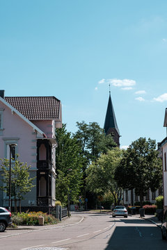 Achern, Baden-Wuerttemberg, Germany - August 05, 2020: View of the street in small german city Achern. Sunny summer day with blue sky