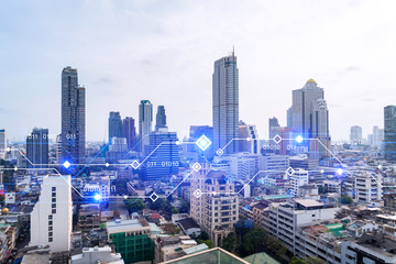 Naklejka na ściany i meble Technology hologram over panorama city view of Bangkok. The largest tech hub in Asia. The concept of developing coding and high-tech science. Double exposure.
