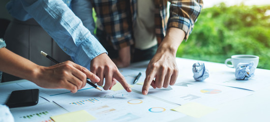 Group of businessman discussing and  working on financial paperwork in the office