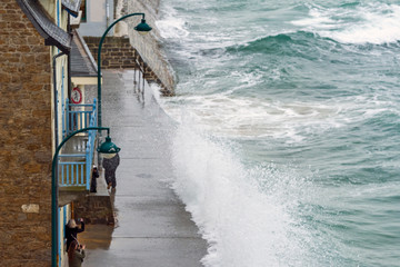 Big high tide and big waves on the Chaussée du Sillon in Saint Malo, Brittany, France