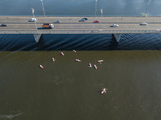 Obraz premium Aerial drone view. Kayak boats under the bridge.