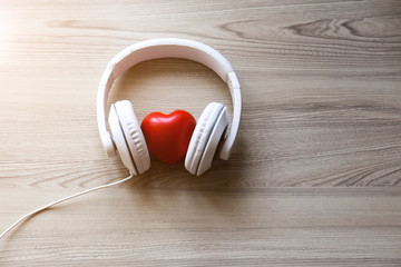 White headphones with red heart sign in the middle