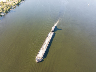 Fototapeta premium Aerial drone view. The barge sails along the Dnieper River.