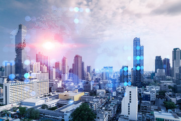World planet Earth map hologram over panorama city view of Bangkok, Asia. The concept of international connections and business. Multi Exposure.