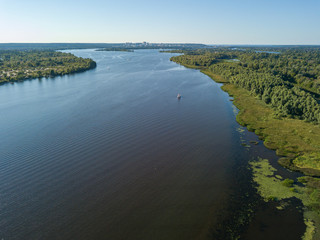 Aerial drone view of green water in the Dnieper river in Kiev.