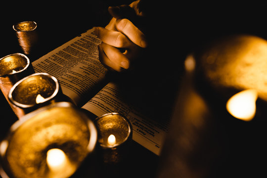 Praying With King James Holy Bible By Candle Light