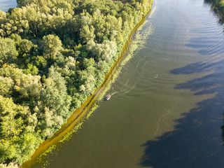 Aerial drone view. Motor boat on the Dnieper river in Kiev.