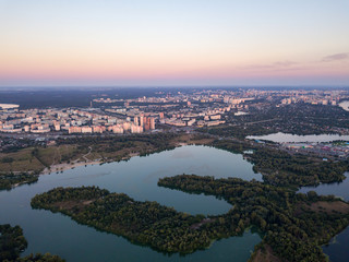 Fototapeta na wymiar Aerial view. Dnieper river and Kiev city at dusk.