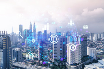 Social media icons hologram over panorama city view of Kuala Lumpur, Malaysia, Asia. The concept of people networking and connections. Double exposure.