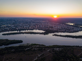 Aerial drone view. Sunset over the Dnieper River and the city of Kiev.