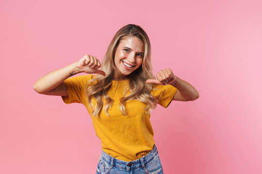 Young woman pointing to herself