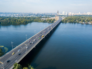 Fototapeta na wymiar Dnieper River and North Bridge in Kiev. Sunny summer day, aerial drone view.