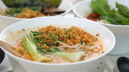  Healthy popular Asian street food. Close up of various types of traditional Japanese ramen soups served in white porcelain bowls