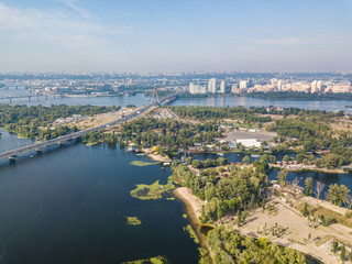 Naklejka premium Dnieper River and North Bridge in Kiev. Sunny summer day, aerial drone view.