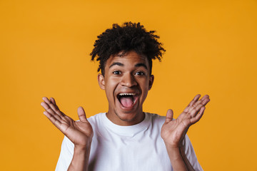 Image of excited african american guy expressing surprise on camera