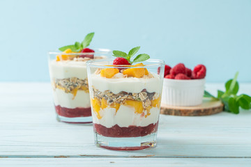 homemade mango and raspberry with yogurt and granola