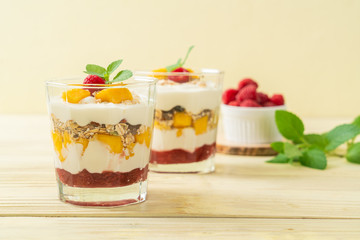 homemade mango and raspberry with yogurt and granola