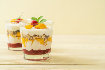 homemade mango and raspberry with yogurt and granola
