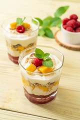 homemade mango and raspberry with yogurt and granola