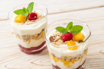 homemade mango and raspberry with yogurt and granola