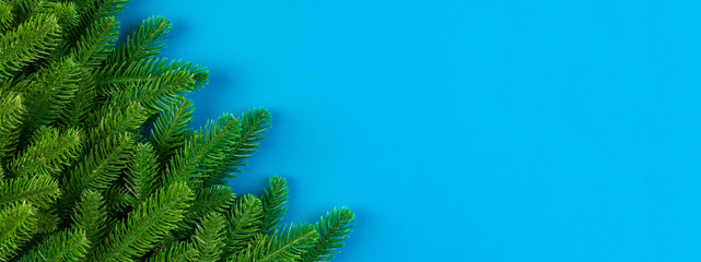 Top view of Banner frame made of fir tree on colorful background with copy space. Merry Christmas concept