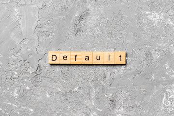 default word written on wood block. default text on table, concept