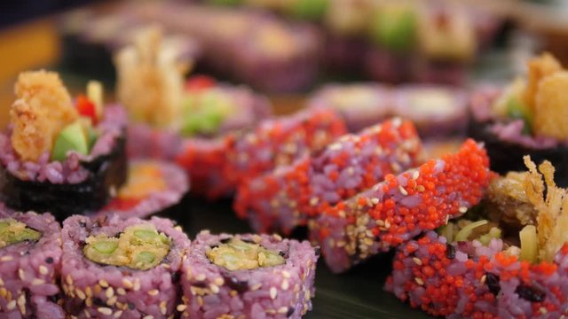 Close up of colorful vegan sushi rolls. Healthy organic asian plant-based food