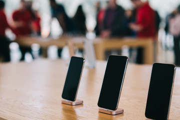 Cupertino , California / USA - November 17, 2018, Apple Park Visitor Center. Modern smartphone with big screen, different models of Iphone, soft focus
