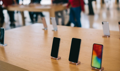 Cupertino , California / USA - November 17, 2018, Apple Park Visitor Center. Modern smartphone with...