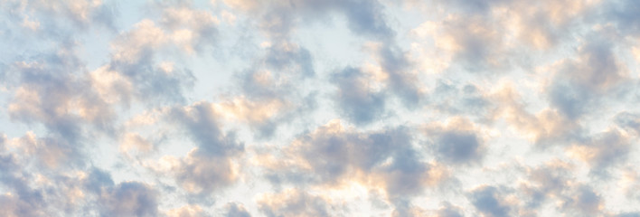 Fluffy, cottony and cloudy blue sky background banner