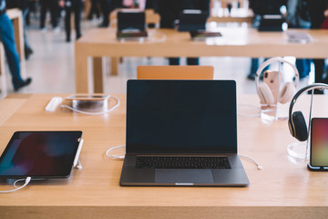 Cupertino , California / USA - November 17, 2018, Apple Park Visitor Center. Laptop Product, Mac Book Pro Computer with Ipad tablet and Iphone near