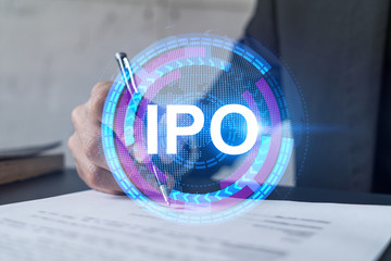 Businessman in suit signs paper. Double exposure with IPO icon hologram. Man signing contract...