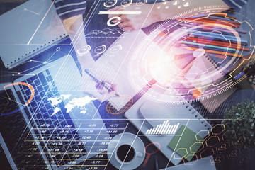 Double exposure of hands making notes with digital coding icons. Computer learning concept.