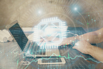 Businessman with computer background with technology theme hologram. Concept of hightech. Multi exposure.