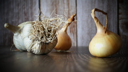 garlic and onions on the table, food illustration on the wooden background