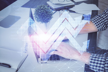 Growing arrows with businessman working on computer on background. Success concept. Double exposure.