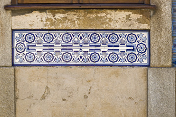 old Portuguese traditional ceramic tiles Azulejos on a wall in Aveiro, Portugal.