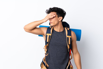 Young Argentinian hiker man over isolated white background covering eyes by hands