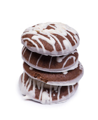 Group of chocolate cookies drizzled with white icing