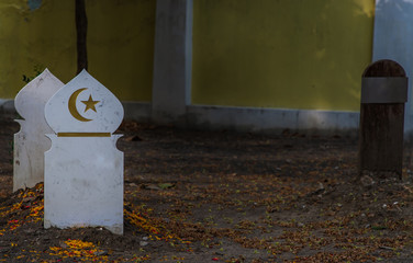 Islamic crescent moon with a star on white wooden. waxing moon muslim symbol on Islamic muslim...