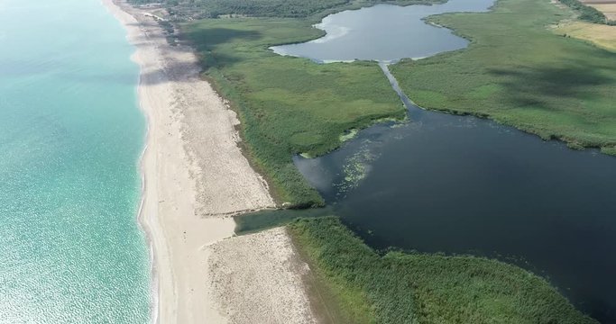 Beautiful landscape of lake, forest, beach and sea. Ezerets and Shabla lakes and Black sea coast in northeast Bulgaria