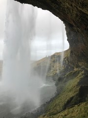 view from behind a waterfall in iceland