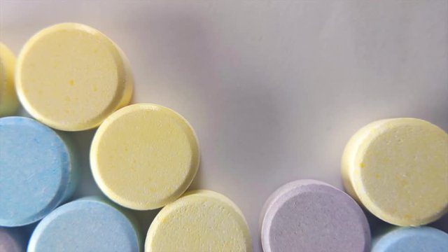 Candy Moving Upward On White Surface