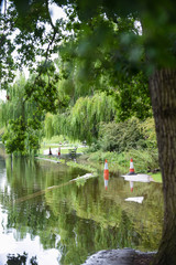 Flood water overflows from a lake during flooding after heavy rain and bad weather
