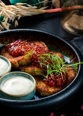 Potato pancakes with red caviar