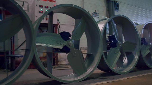 Large metal parts for manufacturing industrial fan for shopping malls and large spaces. 4K FOOTAGE