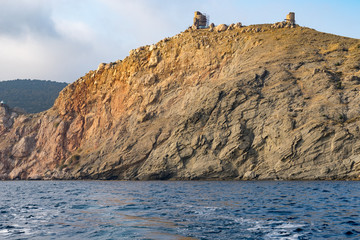 Fototapeta na wymiar view from the sea on a rocky coastline