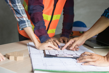 Architect working in office with blueprints,engineer thinking and planning inspection in workplace...
